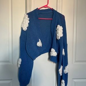 Blue sweater with fluffy clouds